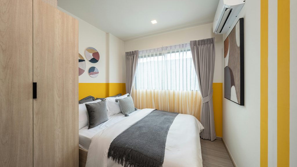 Bed, Wardrobe and Air Conditioner in Room