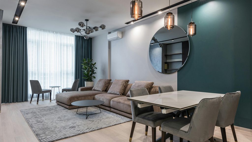 Cozy sofa and table with chairs in contemporary living room