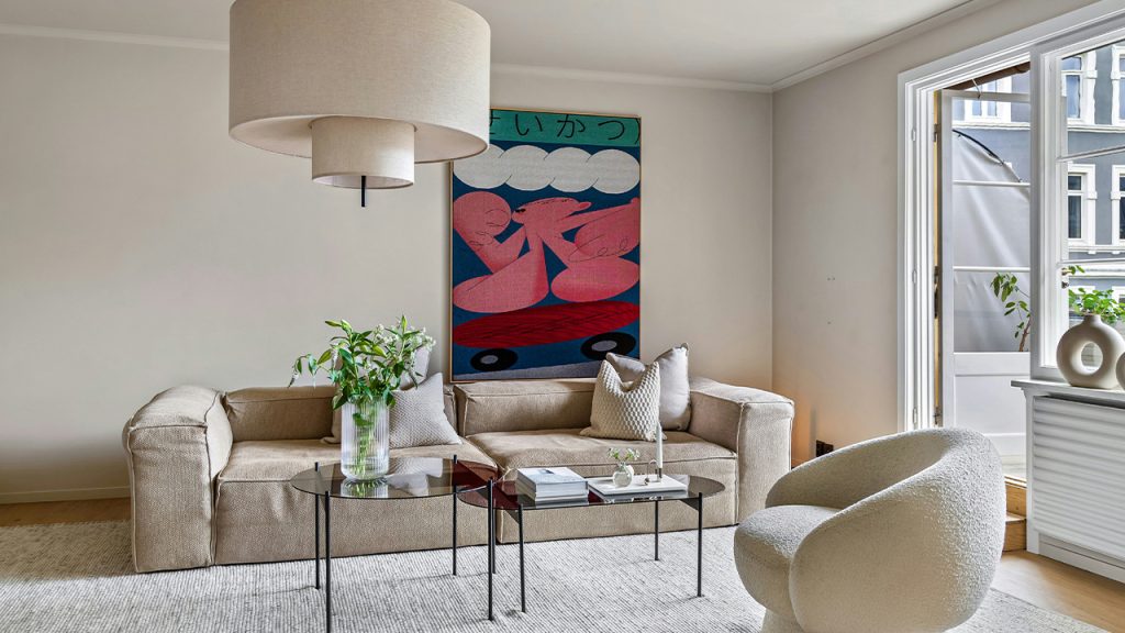 A living room filled with furniture and a large window