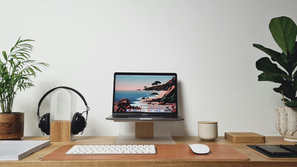 silver imac on brown wooden desk