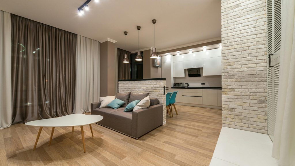 Living room with couch near kitchen