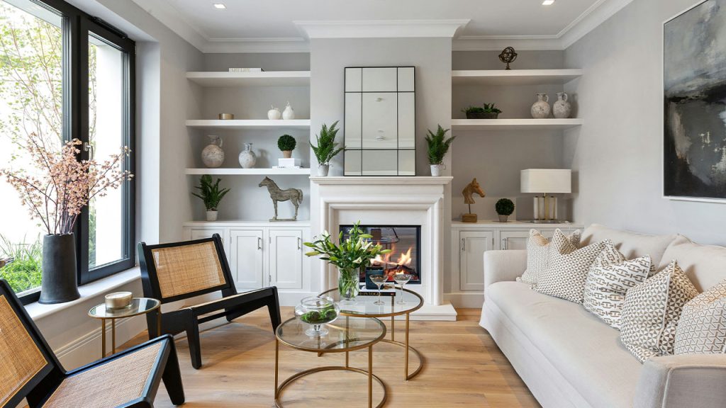 a living room filled with furniture and a fire place