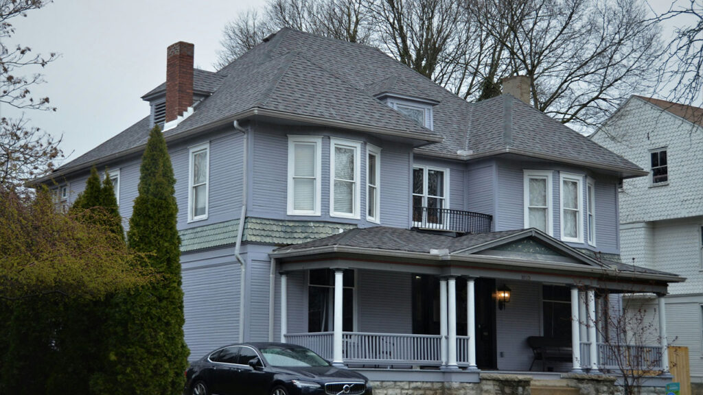 a car is parked in front of a house