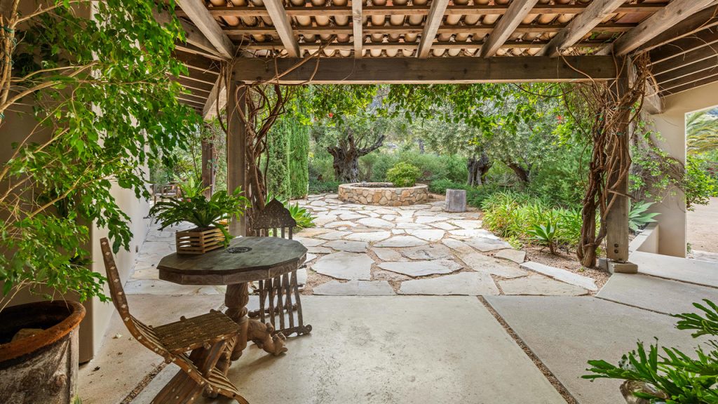 Wooden Furniture under a Roof on the Patio