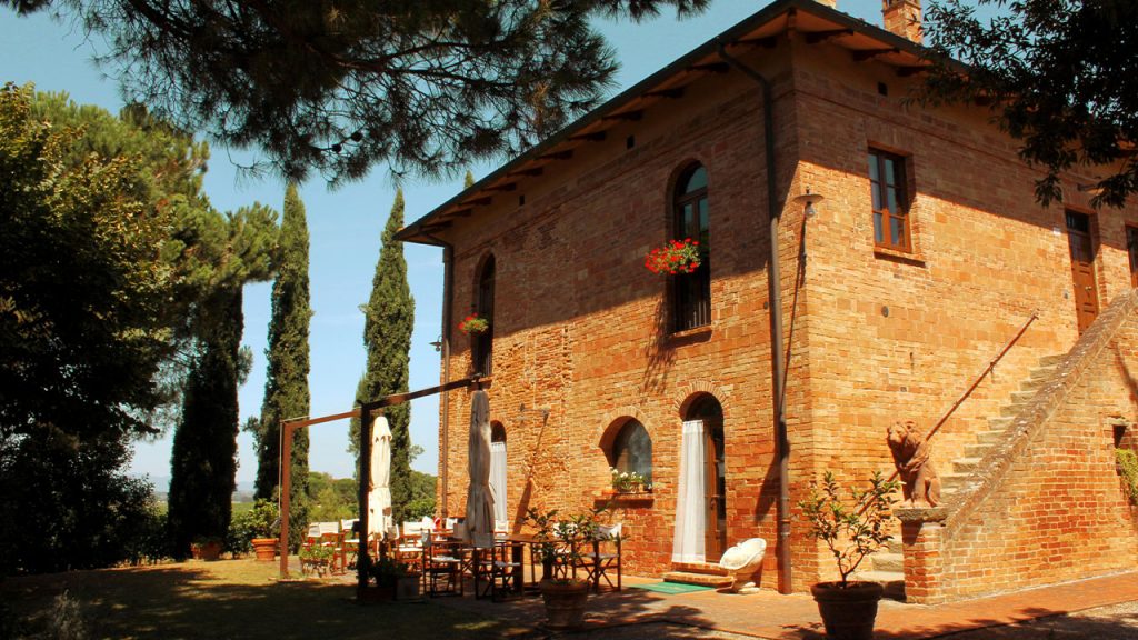 brown concrete building near trees during daytime
