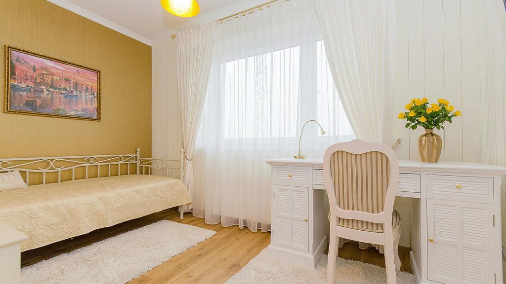 White Wooden Pedestal Desk With Beige Pleated Chair