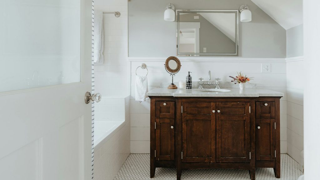 a bathroom with a sink and a mirror