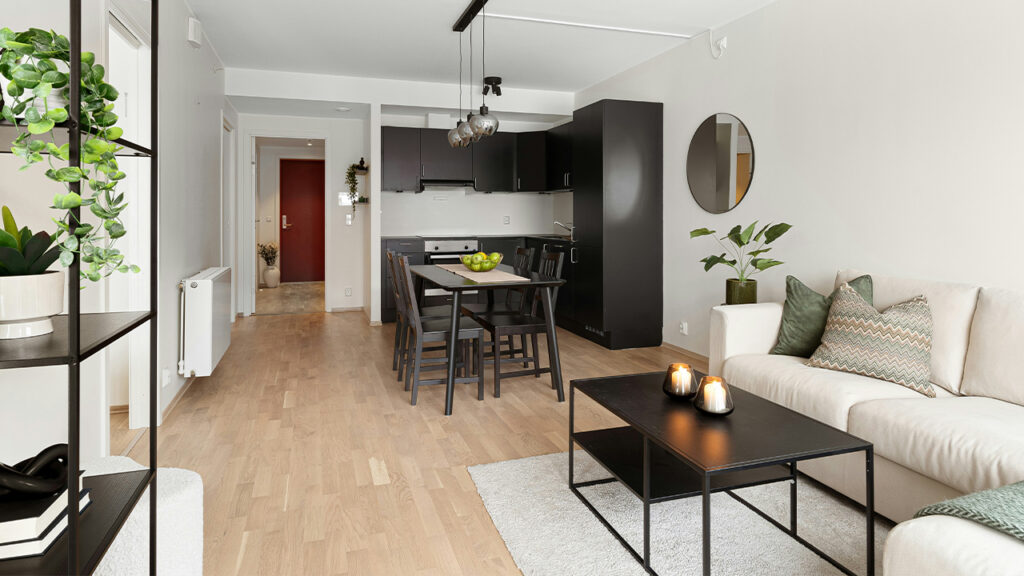 A living room filled with furniture and a dining room table