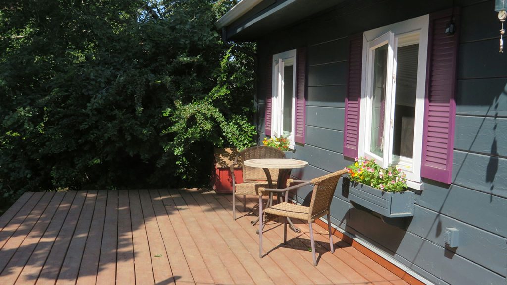 a patio with a table and chairs on it