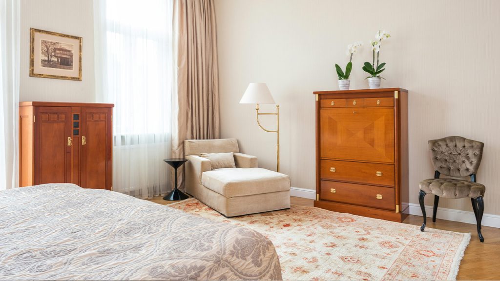 Bedroom interior with bed and classic furniture