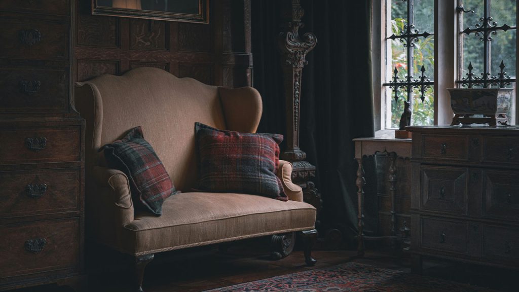 a living room with a couch and a chair