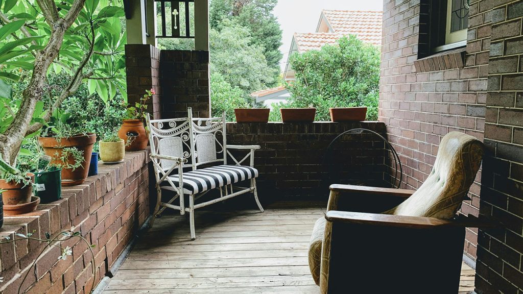 brown and white wicker armchairs