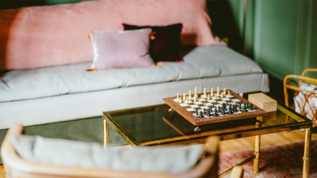 A living room filled with furniture and a chess board