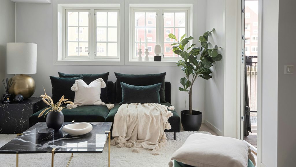 A living room filled with furniture and a large window