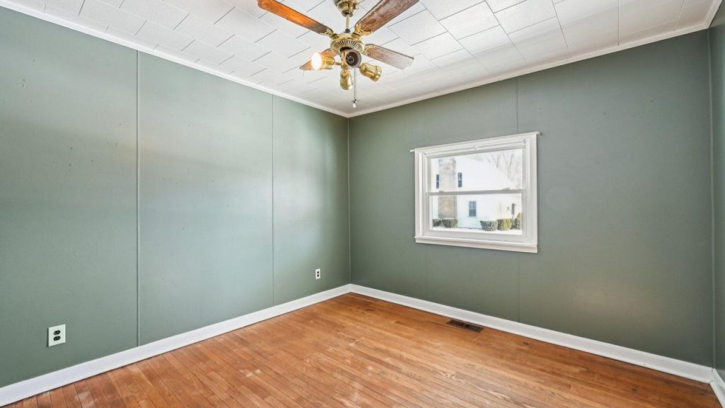Inviting & Sunlit Main Bedroom