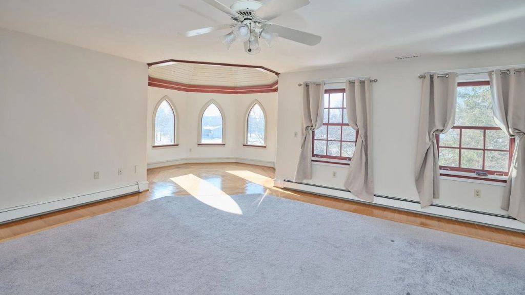 Expansive Bedroom with Arched Windows
