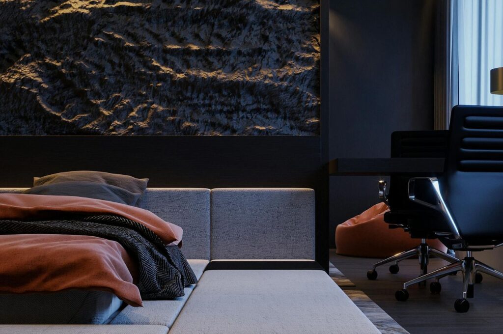 A black bedroom with textured walls.
