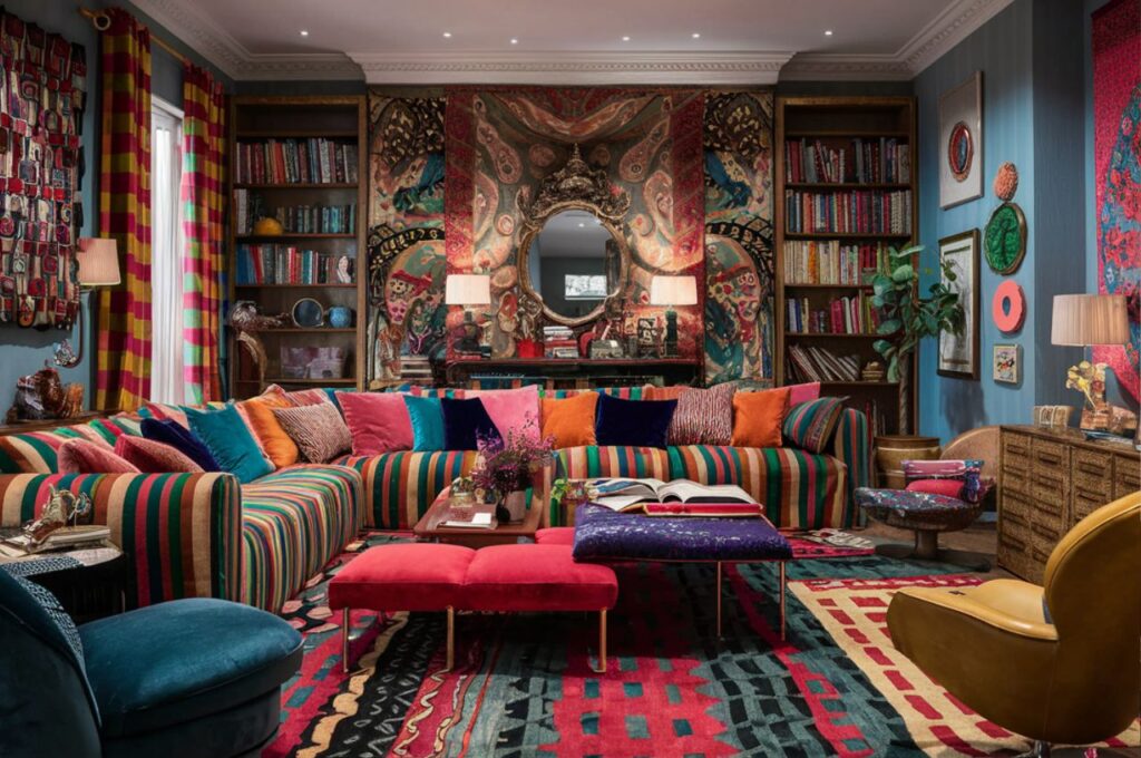 A colorful maximalist living room with a striped sofa.