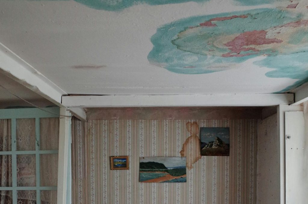 Water damage on walls and ceiling.