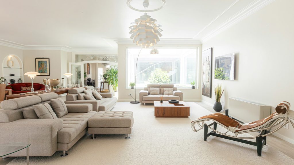 A bright, modern living room with comfortable furniture.