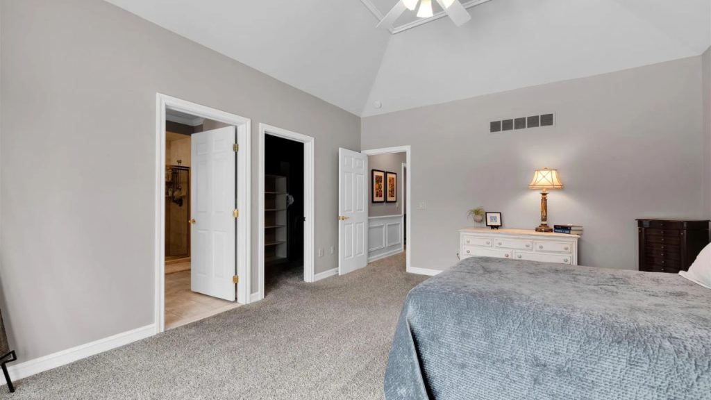 Large bedroom with vaulted ceilings, walk-in closet, and ensuite bathroom.