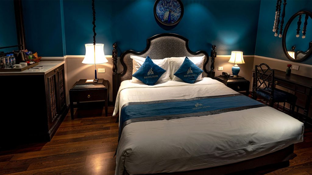 A Bed in Hotel Room with Classic Interior Design