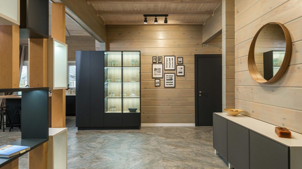 Interior with Wooden Walls, Round Mirror, Shelves and Cupboard