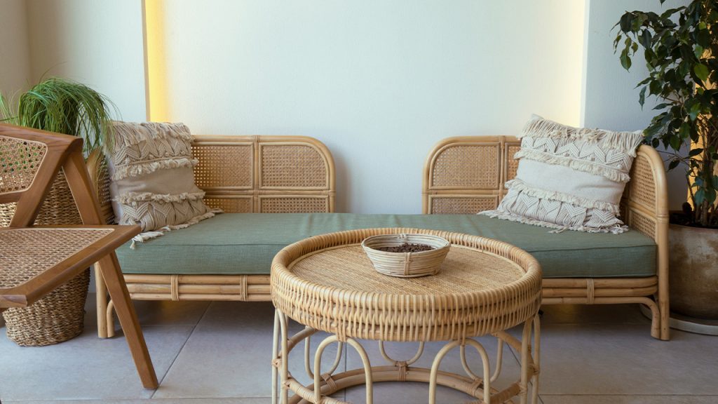 a room with a couch and chairs