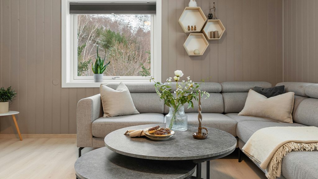 A living room filled with furniture and a large window