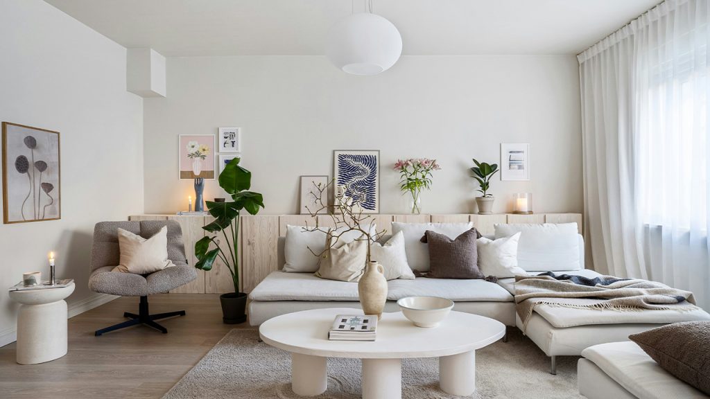 A living room filled with furniture and a large window