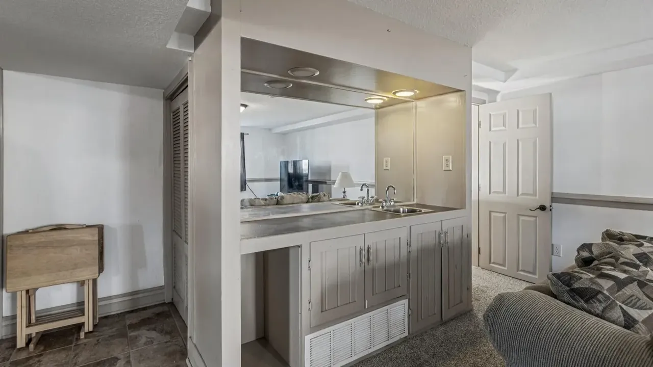 1978 Bi-Level Mahomet Residence With Remodeled Primary Suite and Wet Bar Lounge (With Floor Plan).