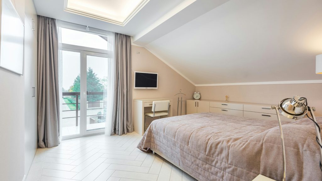 White bedroom with cozy bed