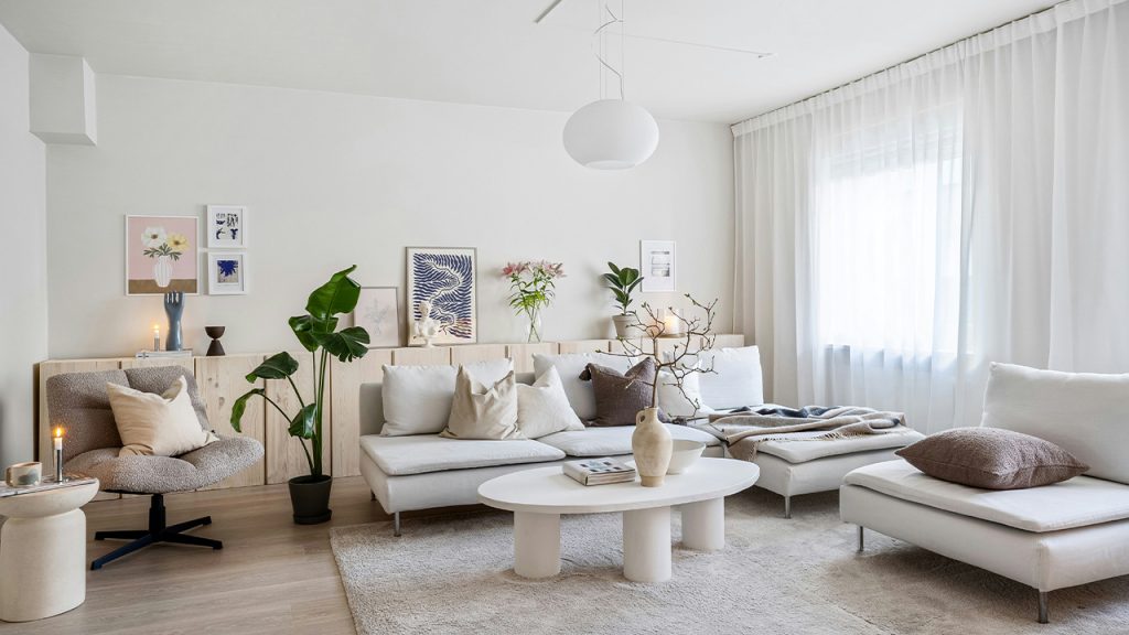 A living room filled with furniture and a large window