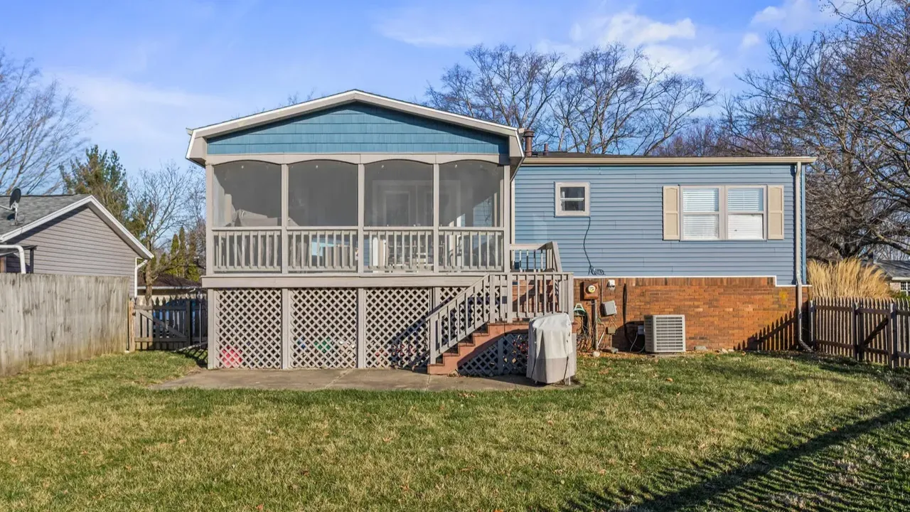 1978 Bi-Level Mahomet Residence With Remodeled Primary Suite and Wet Bar Lounge (With Floor Plan).