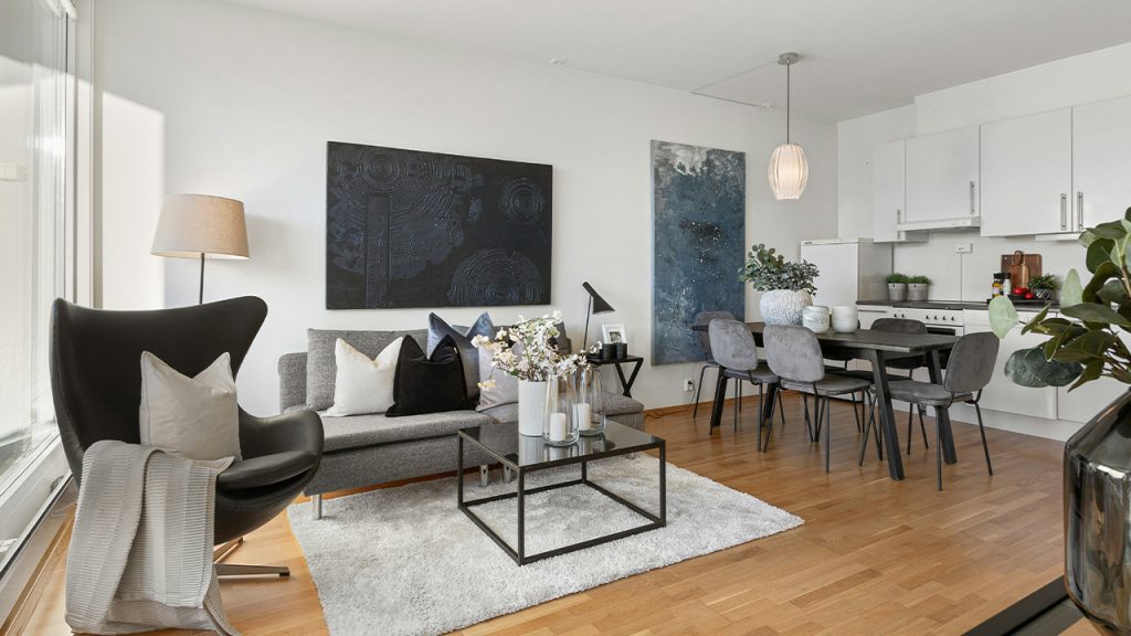 A living room filled with furniture and a large window