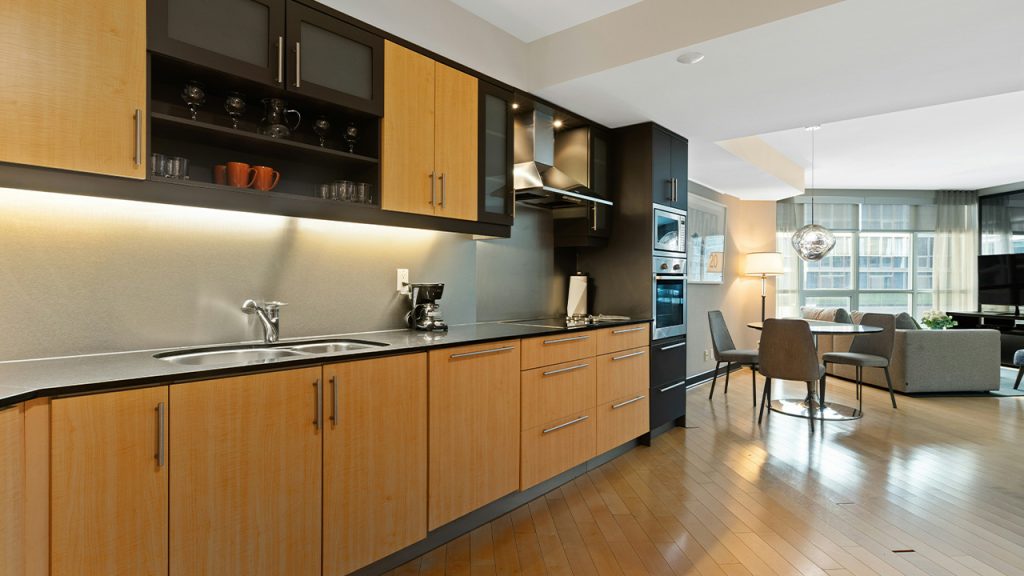 brown wooden kitchen cabinet and sink