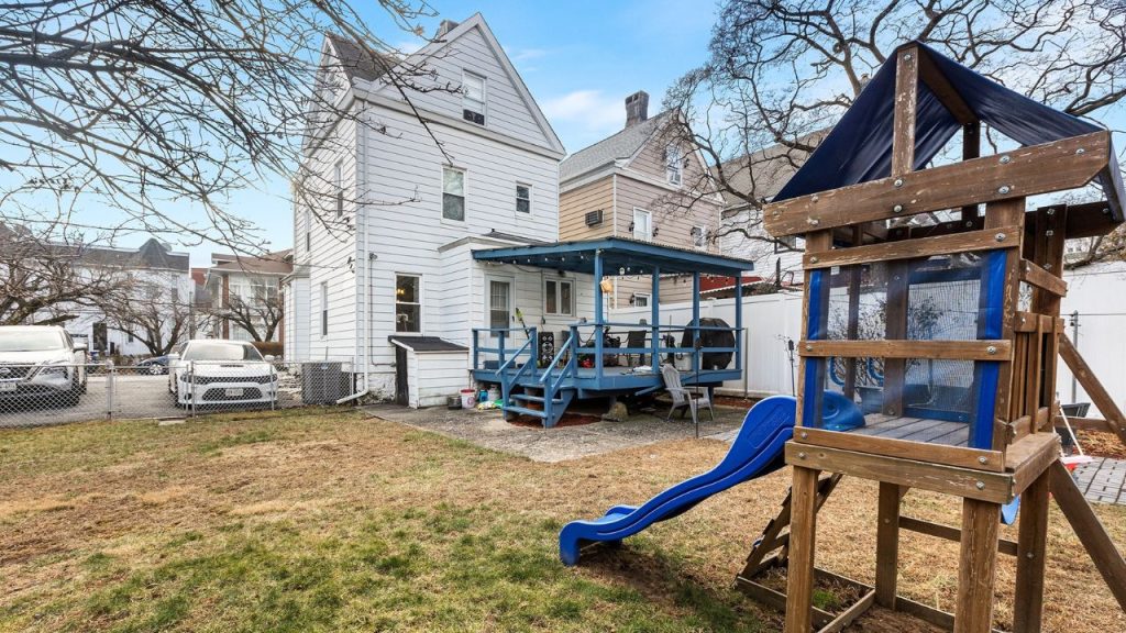 Spacious Backyard with Playset