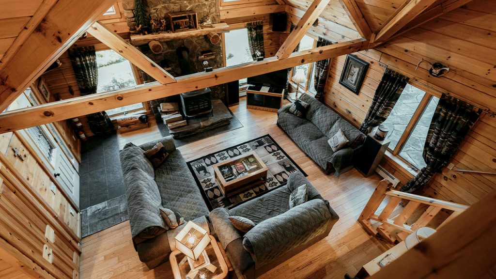 a living room with a wood ceiling