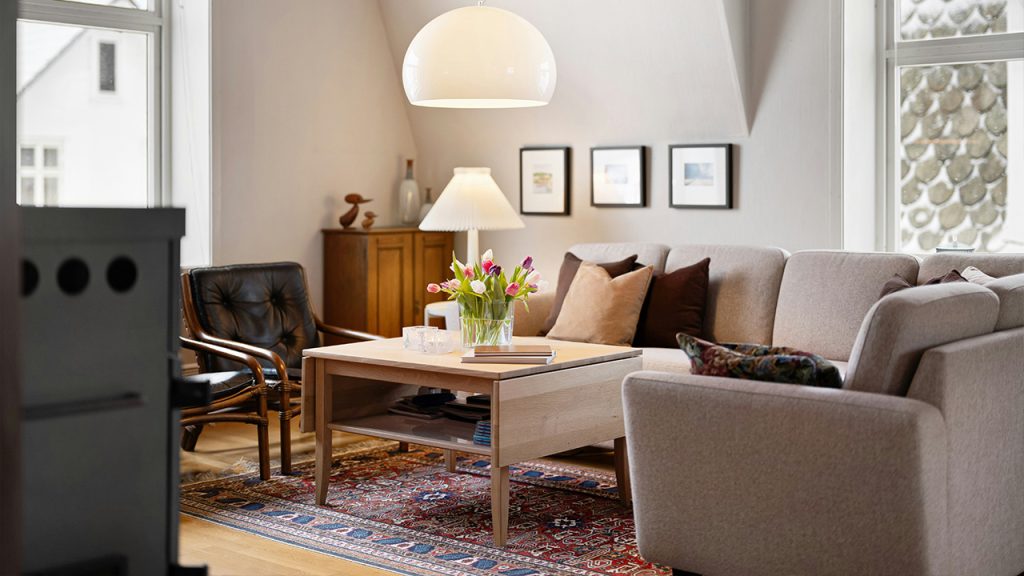 A living room filled with furniture and a large window