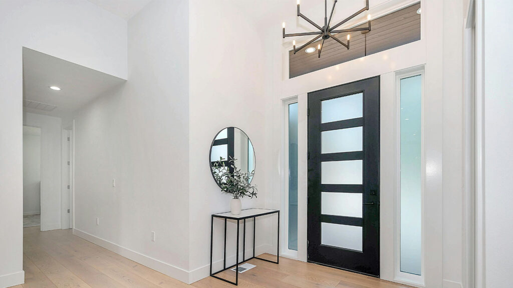 black round wall mirror on white wall