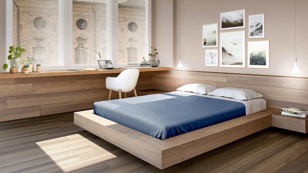 a bed room with a neatly made bed and a desk
