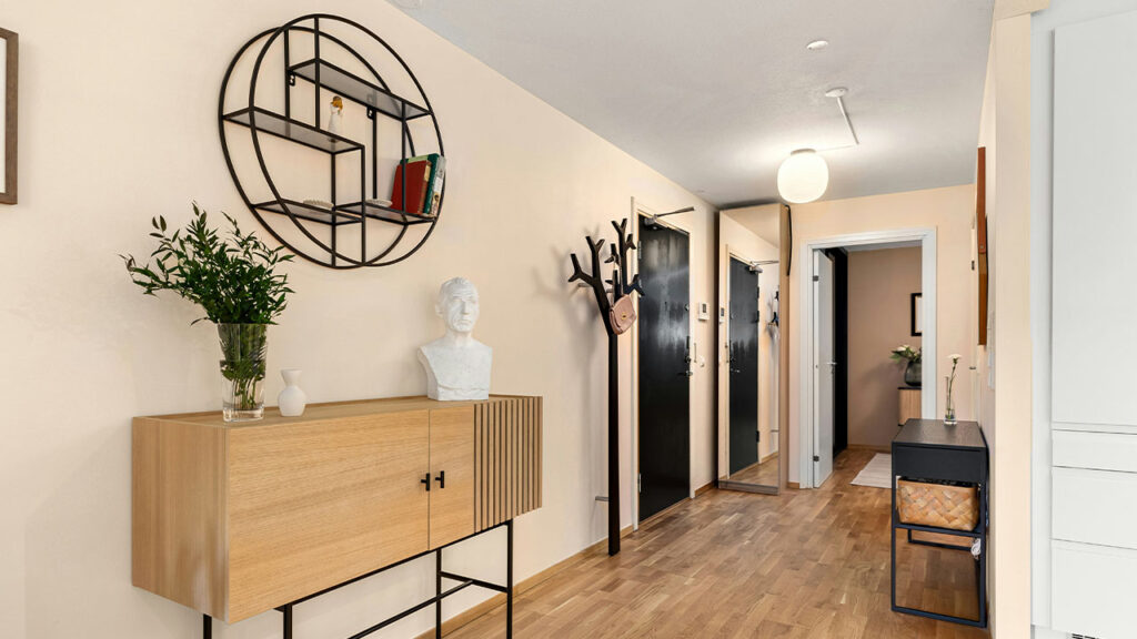 A room with a wooden floor and white walls