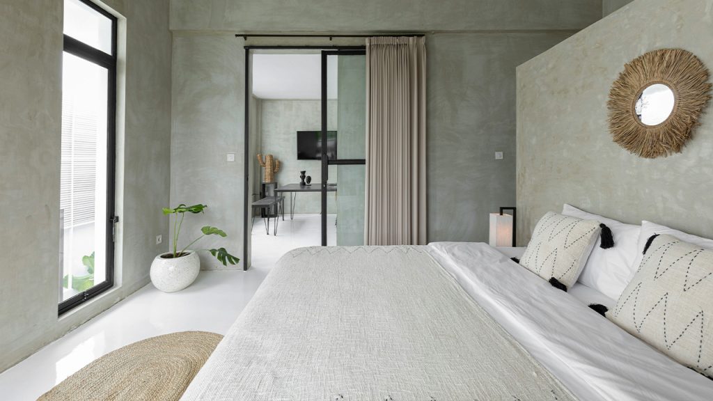 white bed near glass sliding door