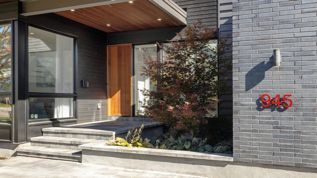 a tree in a pot outside a building