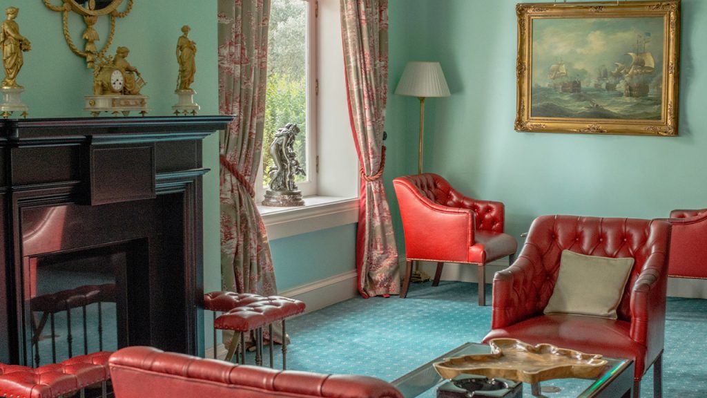 red sofa chair near fireplace