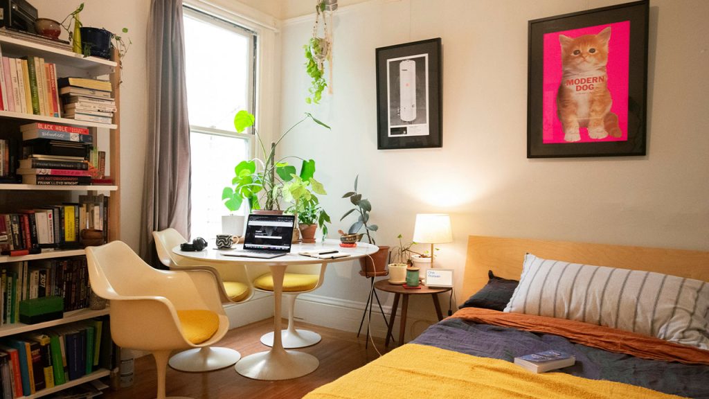 black laptop computer on brown wooden table