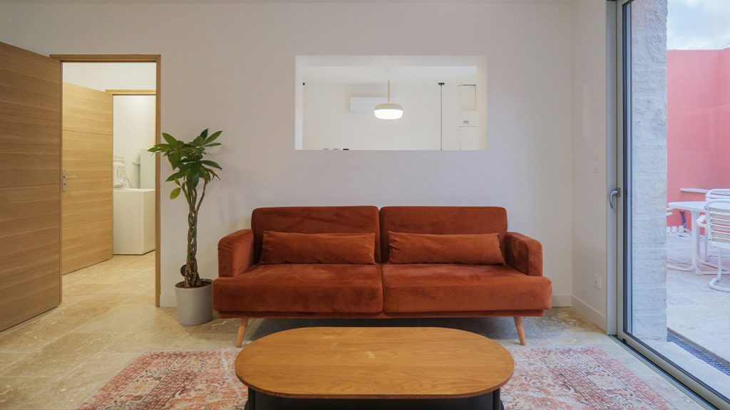 a living room with a couch and a table