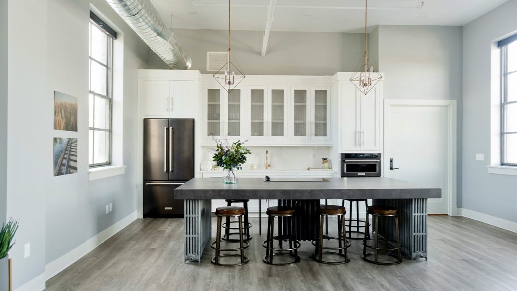 Modern Kitchen Design with industrial island, decor and fixtures.