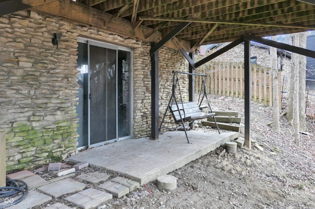 Cozy Covered Patio with Stone Charm