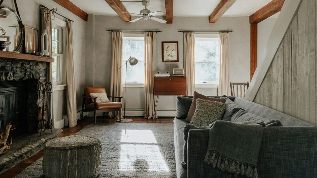 A living room filled with furniture and a fire place